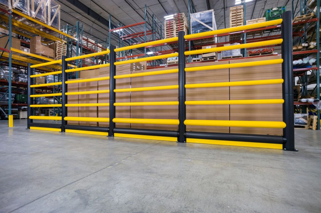 Yellow polymer guard rail barrier in a warehouse
