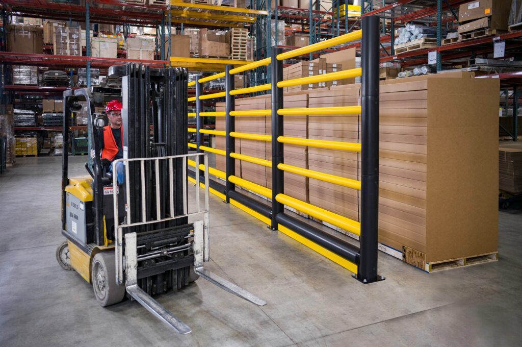 Polymer guard rail barrier alongside a forklift